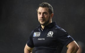 Scotland's halfback and captain Greig Laidlaw reacts after losing their quarter-final match against Australia at Twickenham, on October 18, 2015. AFP PHOTO / MARTIN BUREAU