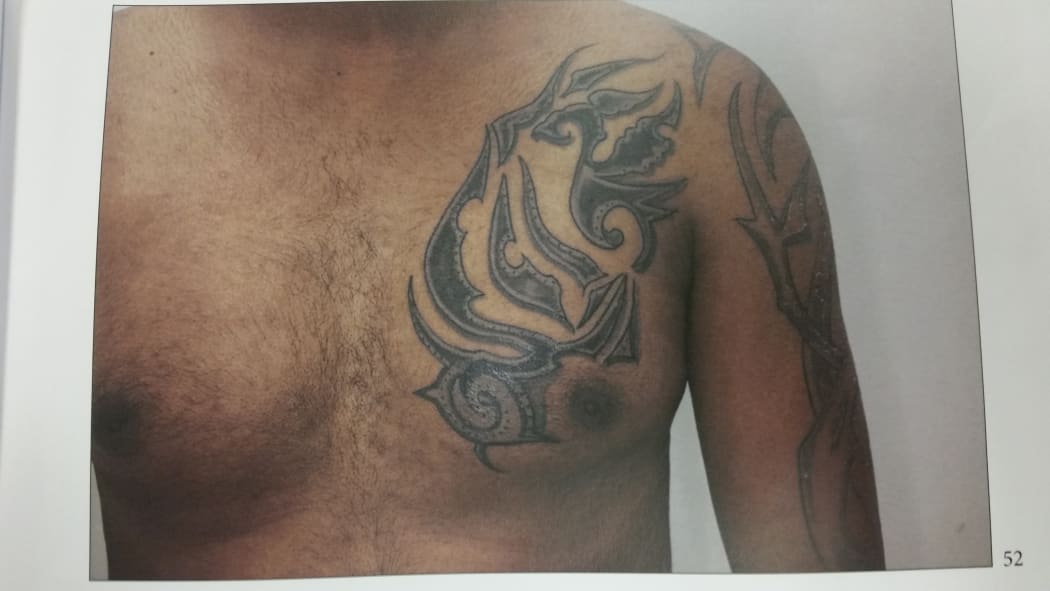 A page in an evidence booklet in court, showing one of the two tattoos referred to by a witness in court today.