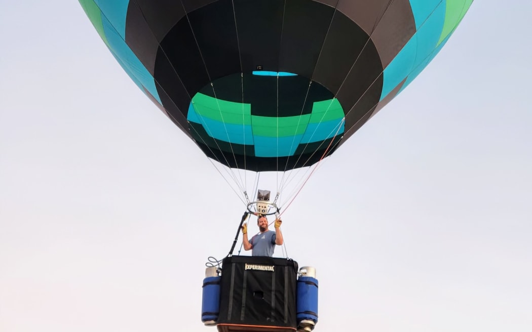 Hot air balloon pilot and maker Michael Toulson in one of his creations.