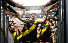MELBOURNE, AUSTRALIA - MARCH 31: Mykelti Lefau of the Tigers celebrates during the 2024 AFL Round 03 match between the Richmond Tigers and the Sydney Swans at the Melbourne Cricket Ground on March 31, 2024 in Melbourne, Australia. (Photo by Michael Willson/AFL Photos via Getty Images)