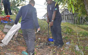RSIPF EOD team scanning for UXO's at the Lengakiki site.