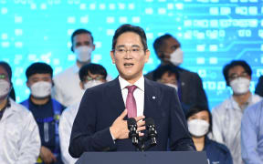 Samsung Electronics Co. Vice Chairman Lee Jae-yong (C) speaks with US President Joe Biden (not pictured) and South Kroean President Yoon Suk-youl (not picture) during a press conference after their visit to the Samsung Electronic Pyeongtaek Campus in Pyeongtaek on May 20, 2022. (Photo by KIM Min-Hee / POOL / AFP)