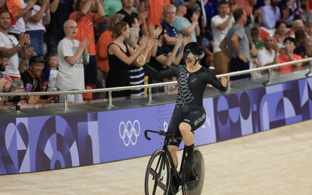 New Zealand’s Ellesse Andrews celebrates winning the women’s track cycling sprint final race 2 for gold of the Paris 2024 Olympic Games at the Saint-Quentin-en-Yvelines National Velodrome in Montigny-le-Bretonneux, south-west of Paris, on August 11, 2024. (Photo by Emmanuel DUNAND / AFP)