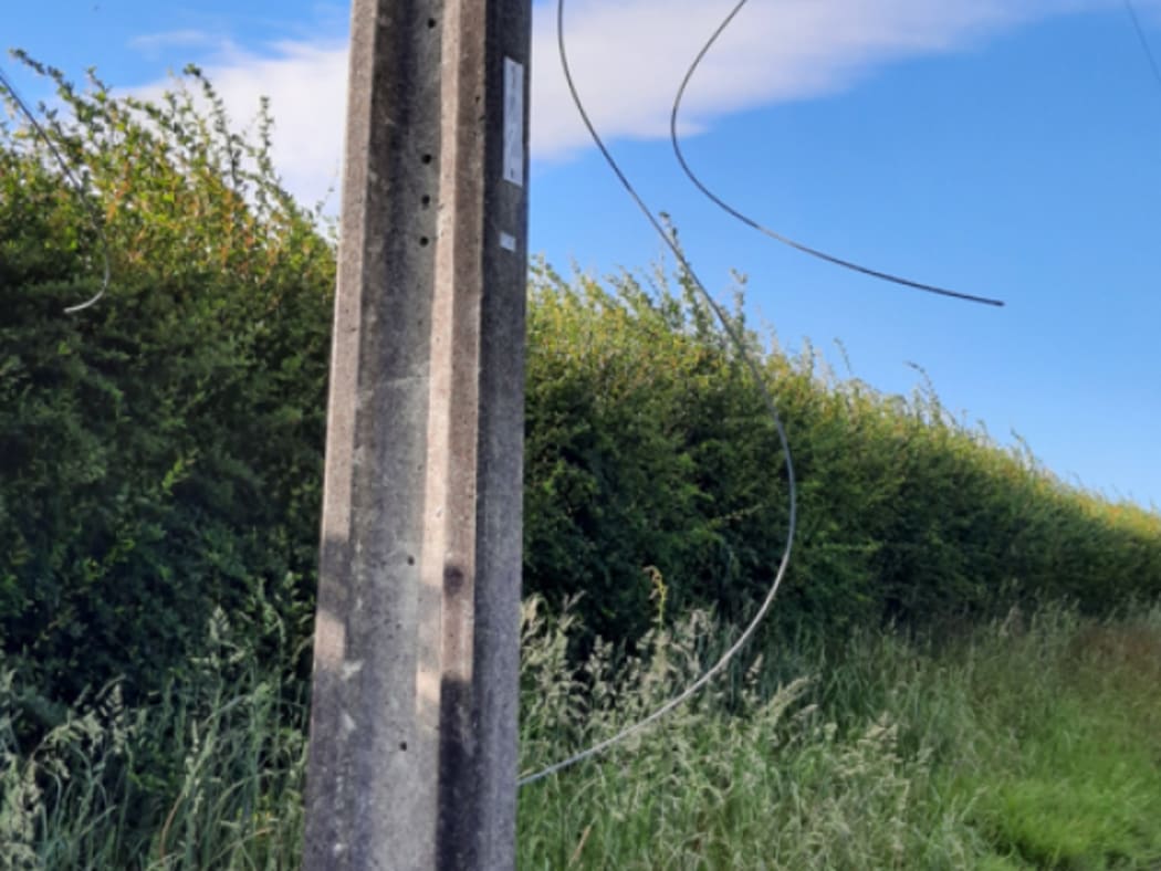 A damaged power pole found in the Manawatū following theft incident.