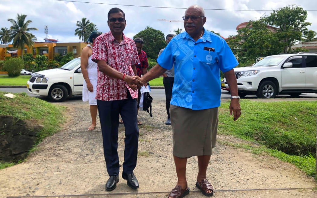 Biman Prasad, left, and Sitiveni Rabuka in December 2022.