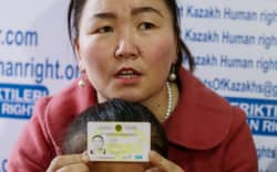 Gulzira Auelkhan, who spent close to two years trapped in China, speaks during an AFP interview at the office of the Ata Jurt rights group in Almaty, Kazakhstan, on January 21, 2019. She is pictured with her five-year-old daughter.