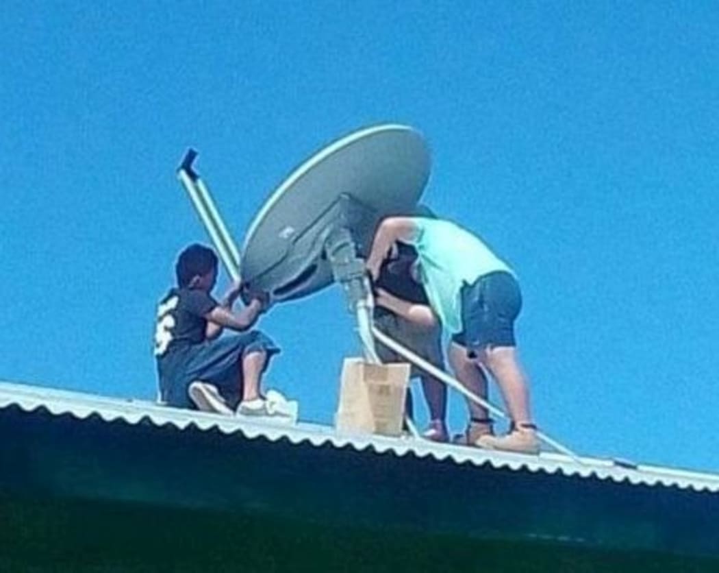 A satellite dish is installed as part of the WIFI project