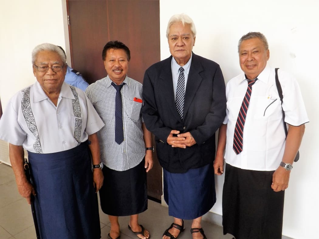 Faamausili Moli Malietoa (second from right) with matais of Malie outside the court room