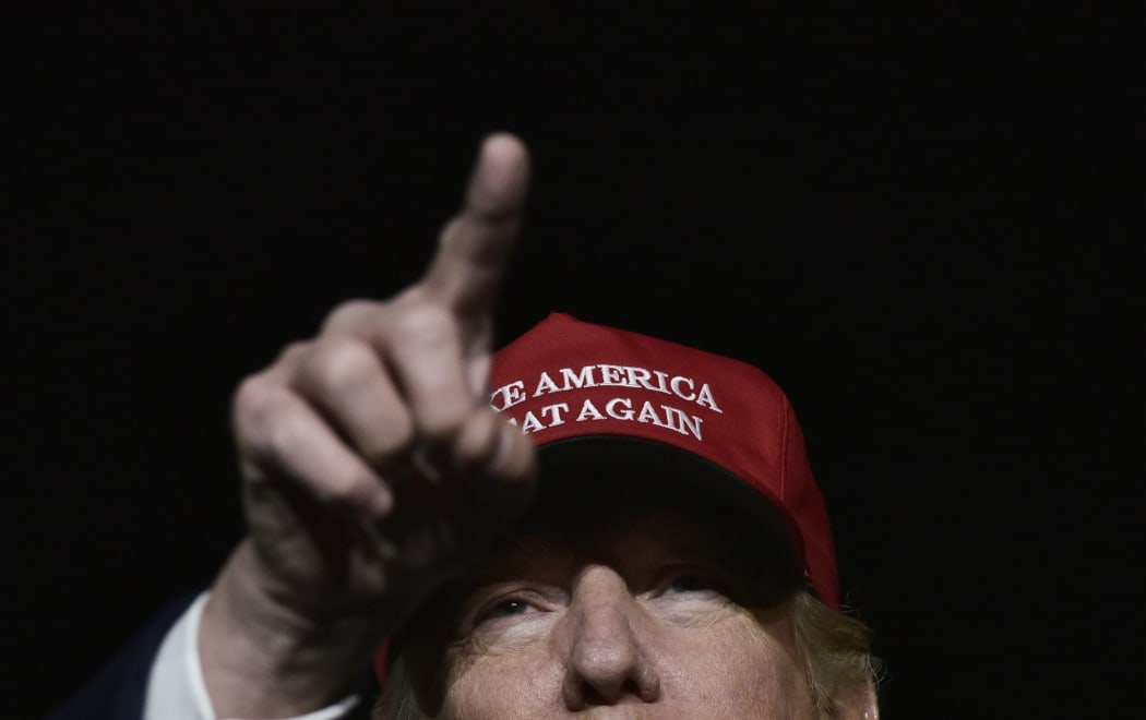 US Republican presidential nominee Donald Trump addresses a campaign rally at Atlantic Aviation in Moon Township, Pennsylvania on November 6, 2016. AFP / MANDEL NGAN