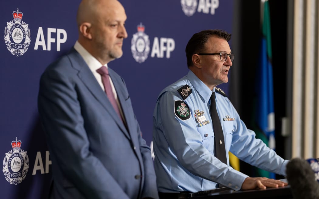 ASIO spy chief Mike Burgess (left) and AFP Commissioner Reece Kershaw.