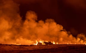 A volcano spews lava and smoke as it erupts in Grindavik, Iceland, December 18, 2023. (Photo by Snorri Thor/NurPhoto) (Photo by Snorri Thor / NurPhoto / NurPhoto via AFP)