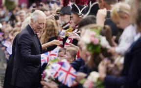 King Charles III meets members of the public during a walkabout in Belfast on 13 September, 2022, during his visit to Northern Ireland.