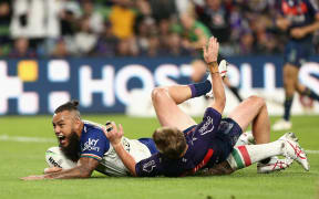 Addin Fonua-Blake of the Warriors crosses the line to score a try during the NRL Round 8 match between the Melbourne Storm and the New Zealand Warriors.