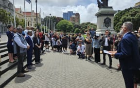 Mātauranga Iwi Leaders Group Chair Rāhui Papa presents a 24,000 strong petition calling for the immediate reversal of the amendment that removed school boards' requirement to give effect to te Tiriti to Minister of Education Erica Stanford.