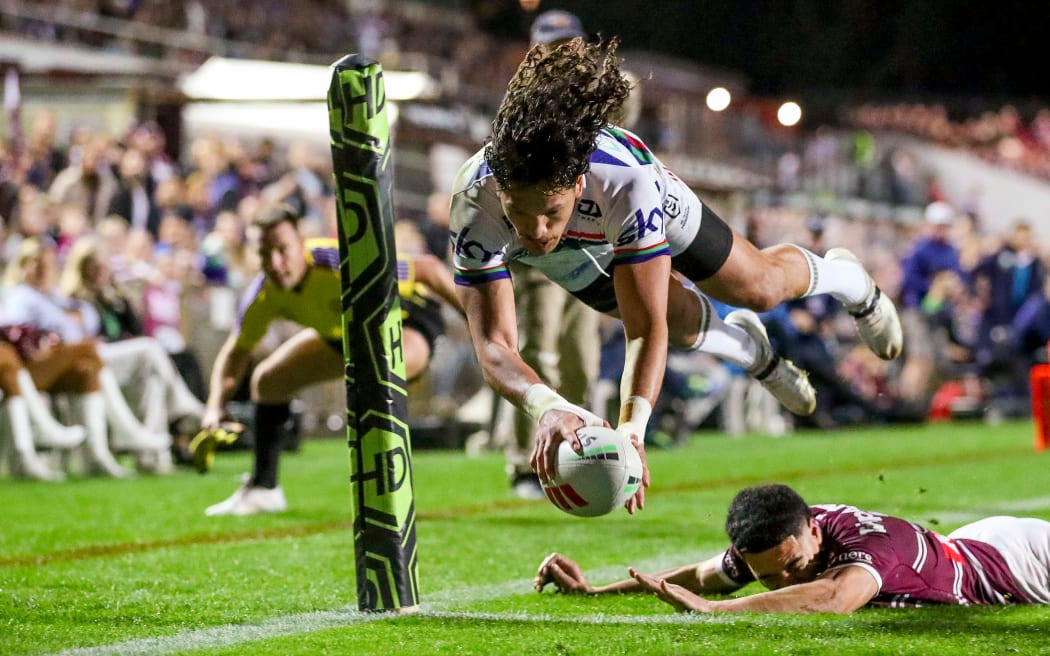 Dallin Watene-Zelezniak dives over to score.