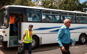 Bus drivers arriving at their stop work meeting at midday today.