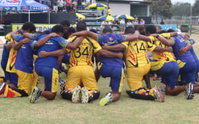 PNG pray following their series win against Namibia.