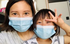 Lily Gao and her 2-year-old daughter Elysse are all packed to go home.