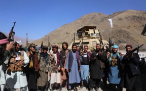 Taliban members pose for a photo after they took over Panjshir Valley, the only province the group had not seized during its sweep last month in Afghanistan on September 6, 2021.