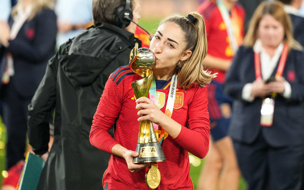 Olga Carmona of Spain kisses the FIFA Women's World Cup Trophy after the team's victory in the 2023 final.