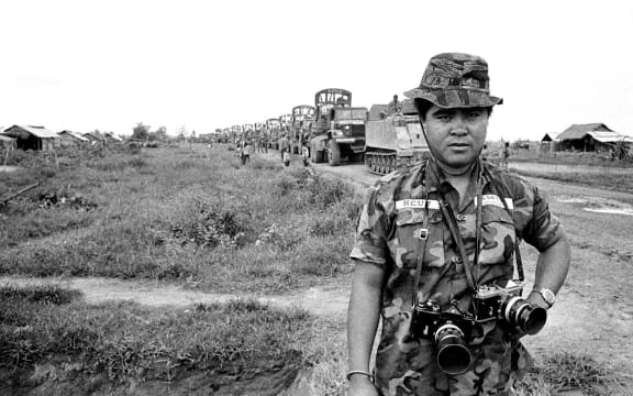 A young Nick Ut wearing camo in Vietnam.