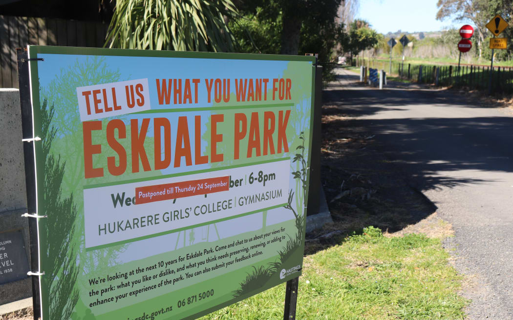 A council ad outside the park for an upcoming community meeting