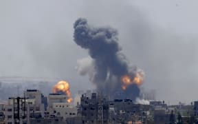 Smoke rises from an explosion caused by an Israeli airstrike in Gaza City, Saturday, May 4, 2019.