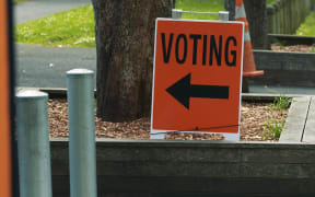An orange voting sign.