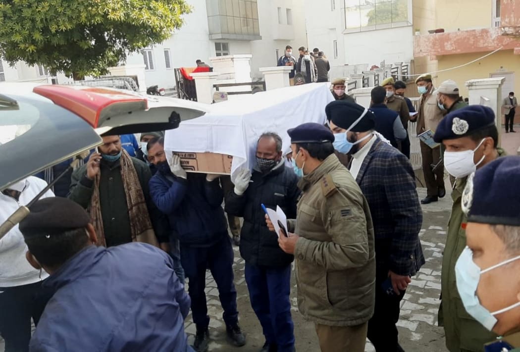 Hospital staff and relatives carry the coffin of a victim who died in a stampede at the Vaishno Devi shrine, one of India's most revered Hindu sites.