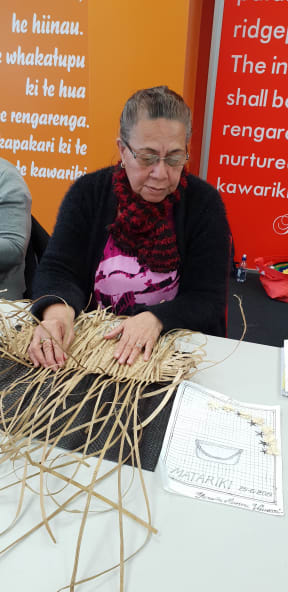 Fesaitu Vaurasi of Rotuma works on a mat inspired by the Matariki's seven stars and the Rotuman seven-star tefui (lei).