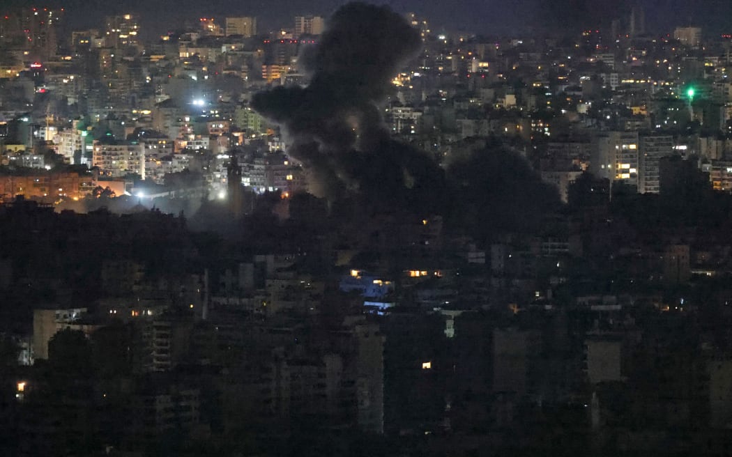 Smoke rises from the site of an Israeli air strike targeting the southern suburbs of Beirut, November 23, 2024. - At least three new night-time strikes targeted the southern outskirts of the Lebanese capital Beirut late Friday November 22 into early Saturday, images from AFP and state media showed.
