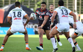 Warrior Sam Lisone is tackled during the NRL match Warriors v West Tigers at Mt Smart Stadium on Sunday 28 August 2016.