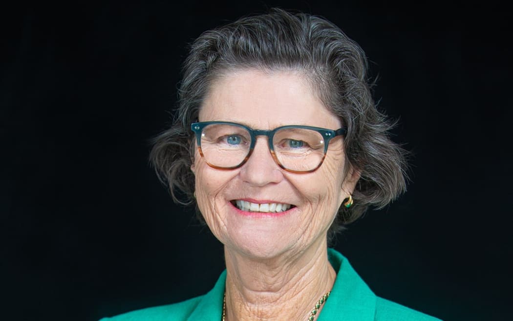 Ministry of Education of New Zealand. Profile Imagery of Iona Holsted Chief Executive and Secretary for Education. Black background with green jacket. Photo : February 2022 - Jeff McEwan / Capture Studios