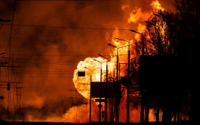 A gas station burns after Russian attacks in the city of Kharkiv, on March 30, 2022, amid Russian invasion of Ukraine.