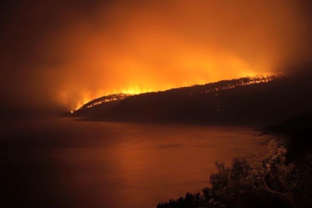 A fire raging overnight has destroyed 50 homes in Victoria.