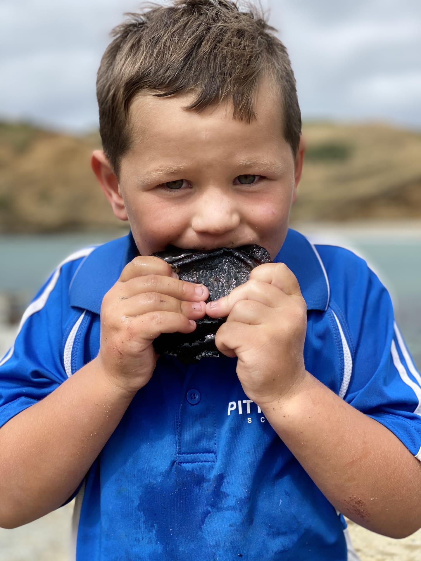 Rydge Lanauze eating paua