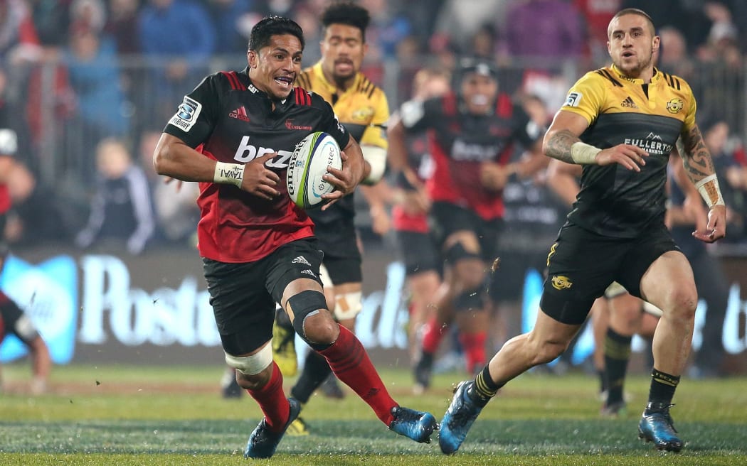 Pete Samu on the burst for the Cruasaders with the Hurricanes skipper TJ Perenara in pursuit.