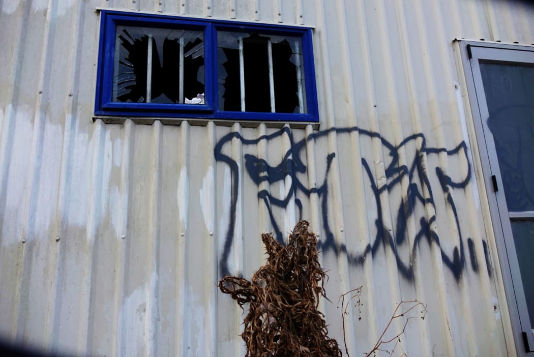 Vandalism with the letters FTW, which stands for F*** The World, shows the hopelessness felt by local youths.