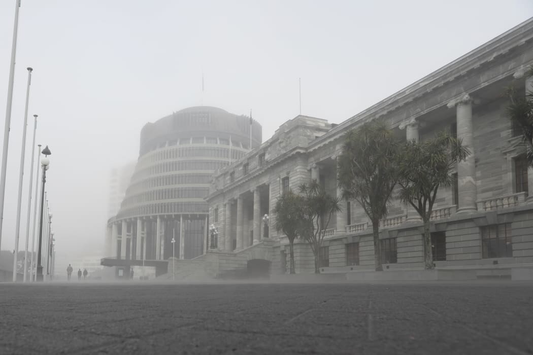 Parliament House and the Beehive wreathed in heavy mist during winter 2019