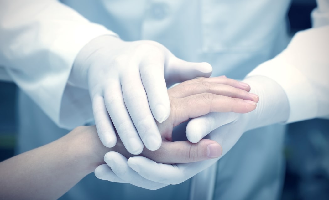 Hands of the doctor and patient