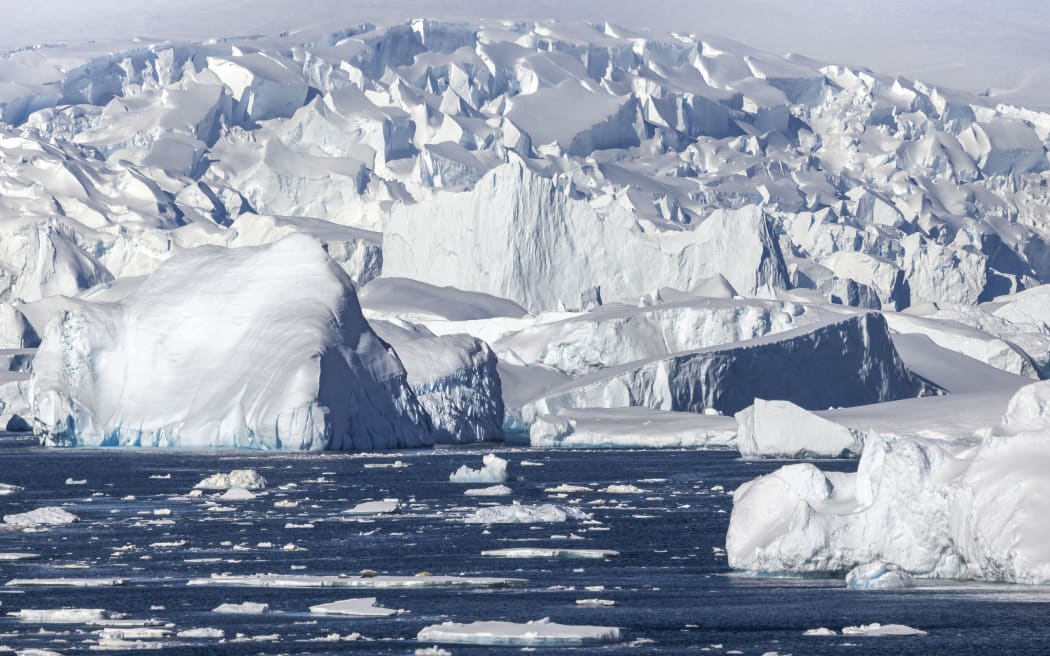 Iceberg and large fragments of drifting ice, here iceberg floating in front of the Antarctic Peninsula, climate melting global warming. Marguerite Bay, George VI Channel. Expedition below the South Polar Circle in Antarctica (Photo by Claudius Thiriet / Biosphoto / Biosphoto via AFP)