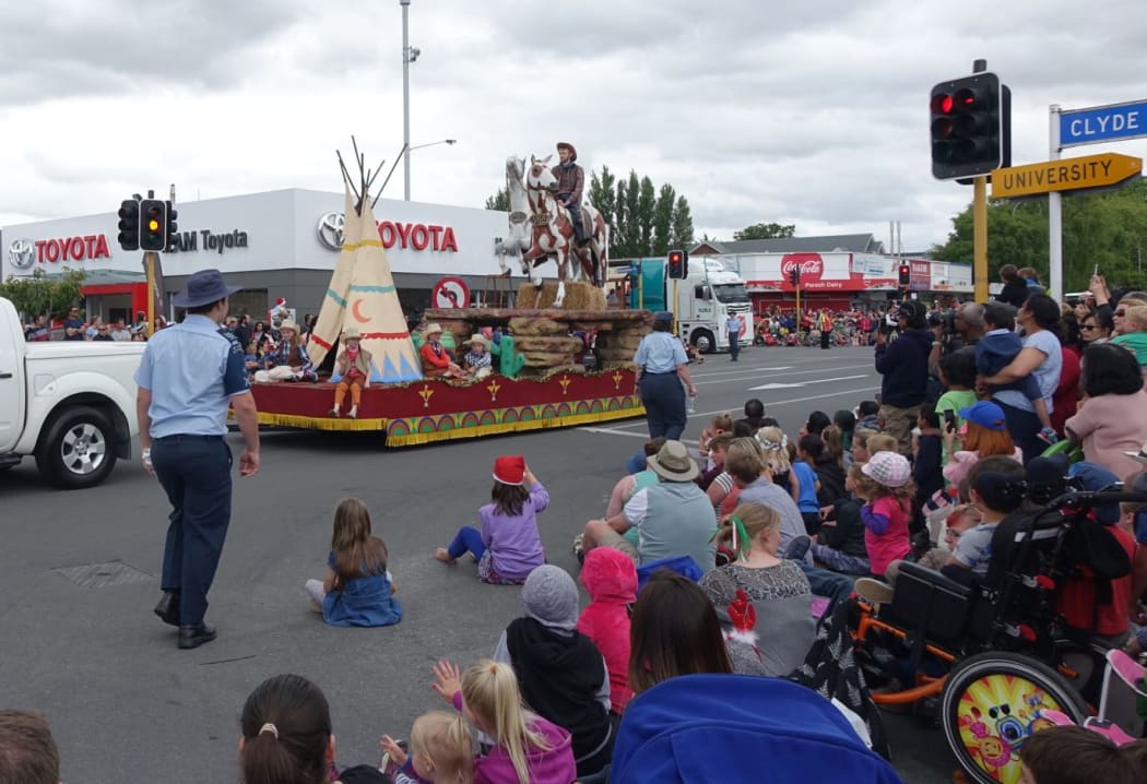 The Ojibwe costumes were removed from the float after complaints, but the cowboys and horses remained.