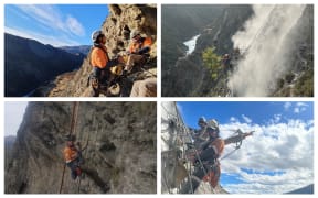 Abseilers at work on rockface known as the Yates Feature, on the Nevis Bluff