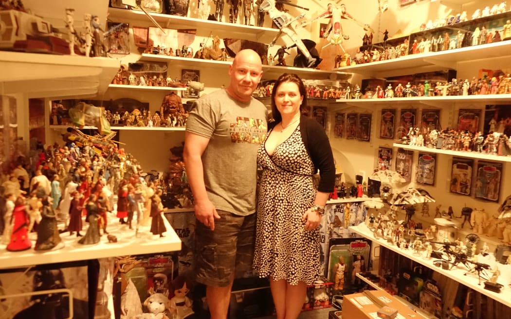 Matt and Kristy Glasgow, pictured next to part of their extensive collection, could be the country's biggest Star Wars fans.