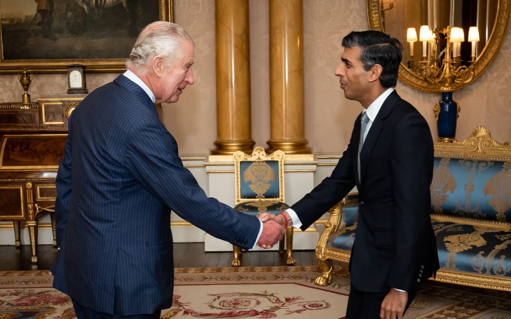 King Charles III greets Conservative Party leader and incoming prime minister Rishi Sunak during an audience at Buckingham Palace in London on October 25, 2022, where Sunak was invited to form a government.