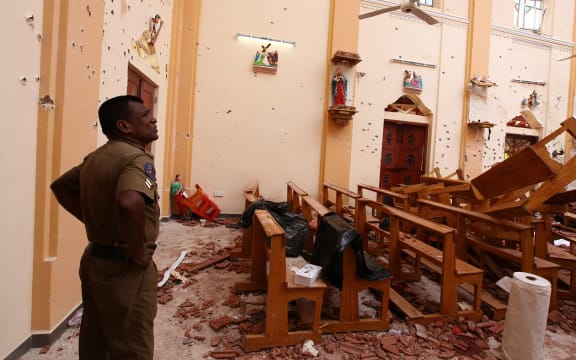 Officials inspect the damaged St. Sebastian's Church after multiple explosions targeting churches and hotels across Sri Lanka on Easter Sunday, April 21, 2019 in Negombo, north of Colombo, Sri Lanka.