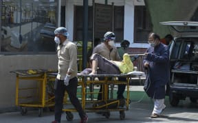 A Covid-19 patient arrives at the GTB hospital in New Delhi on 29 April 2021.