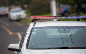 A police car out in the community. 6 July 2016.