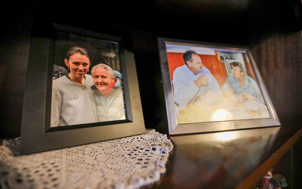 Long-time Labour supporter Nan Dixon, 91, has photos of herself with former Labour leaders Jacinda Ardern and David Shearer on her bookshelf. Labour leader Chris Hipkins met with Dixon while campaigning on the West Coast on 14 September, 2023.