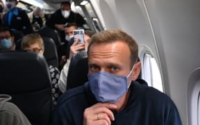 Russian opposition leader Alexei Navalny in a plane before takeoff from Germany bound for Moscow.